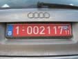 Temporary plate; valid until end of February 2011. 1 = standard plate<br>Blue sticker = taxes paid (while a red sticker means tax free)