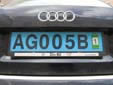 Diplomatic plate with a validation sticker.<br>Since 2010, validation stickers are not used anymore.<br>AG = Angola. B = Embassy owned vehicles