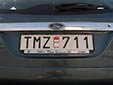 Normal plate (old style, but still issued on request) and with<br>a red and white sticker covering a green validation sticker.<br>Since 2010, validation stickers are not used anymore.