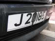Normal plate (front). J = Jersey