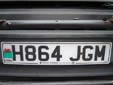 Normal plate (front) with an unofficial, but permitted, CYMRU band<br>CYMRU = Wales. H = registered between August 1990 and July 1991<br>GM = Reading