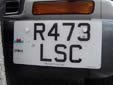 American size plate (front) with an unofficial, but permitted,<br>CYMRU band. CYMRU = Wales. R = registered between<br>August 1997 and July 1998. SC = Edinburgh