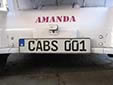 Taxi plate. CABS = electric mini cab
