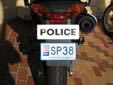 Police motorcycle plate. SP = police