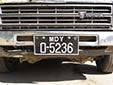 Normal plate for old vehicles (only a single letter before the hyphen)<br>MDY = Mandalay Region