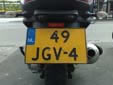 Normal plate on what looks like a motorcycle, but is a 3-wheel vehicle.<br>Therefore it has a 'car' plate and not a motorcycle plate (on a<br>motorcycle plate the three-letter combination begins with an M).