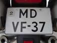 Temporary motorcycle plate. 10 = valid until the end of October<br>M = motorcycle