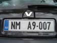 Normal plate (old style) with a missing town crest. NM = Novo Mesto