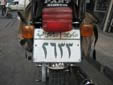 Government owned motorcycle plate<br>Arabic text: motorcycle (top left) and government (top right)