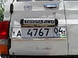 Normal plate (old style) with unofficial flag sticker<br>04 = Gorno-Badakhshan autonomous province<br>PT = Республика Таджикистан (Republic of Tajikistan)