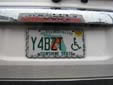 Handicapped driver's plate (2003 series) from Miami-Dade County<br>Plates with 'Sunshine State' are issued in Miami-Dade County only