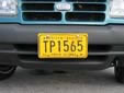 Taxi plate (old style). TP = St. Thomas taxi